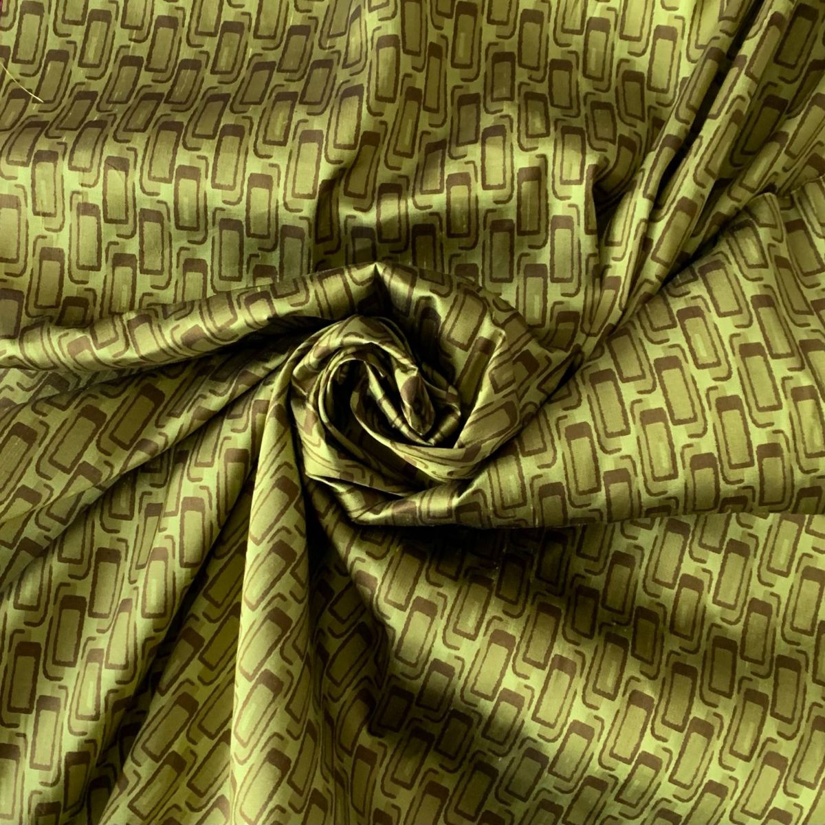 Geometric printed taffeta in green and brown